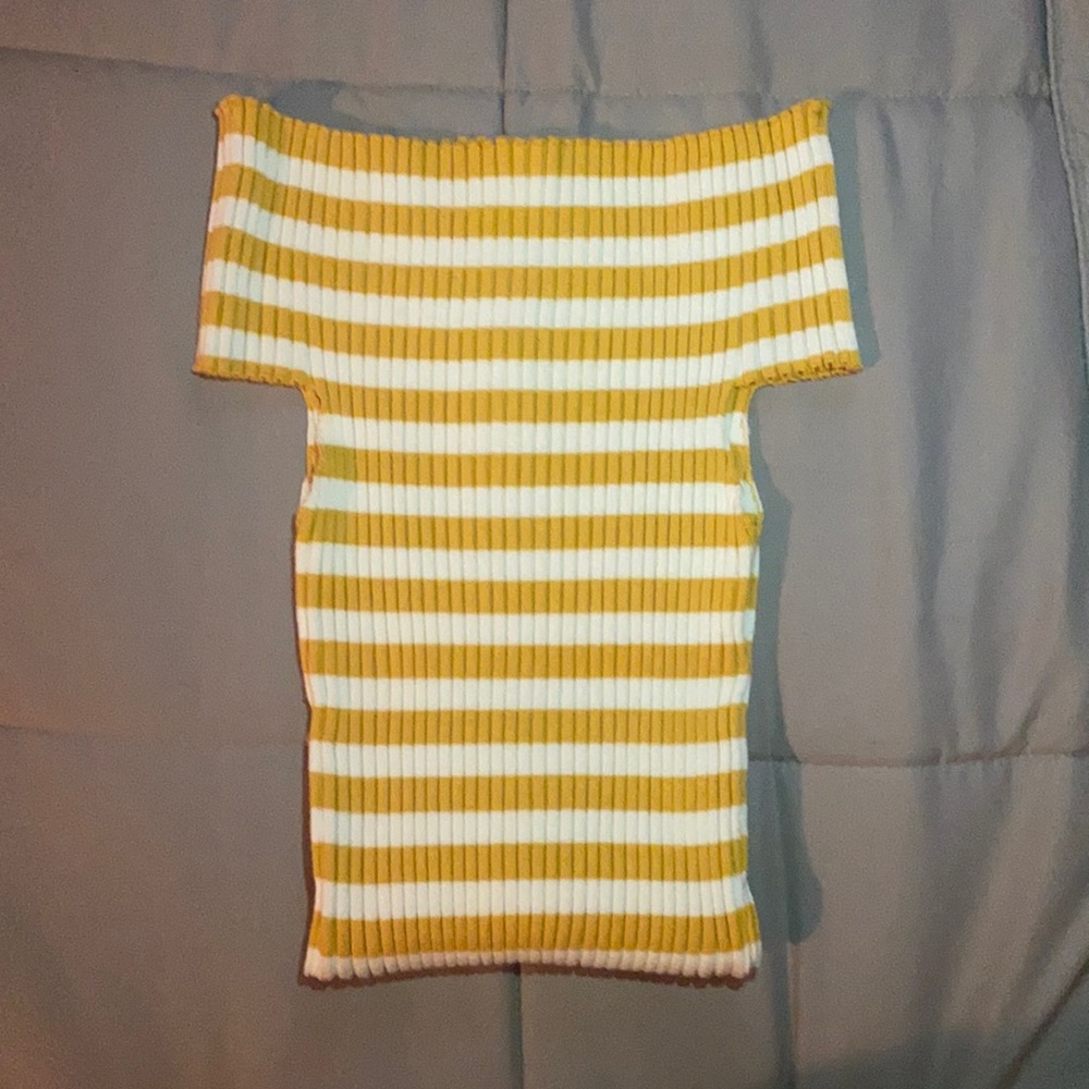 Bright New Yellow crop top that is stretchy and slim down to the shoulders.
